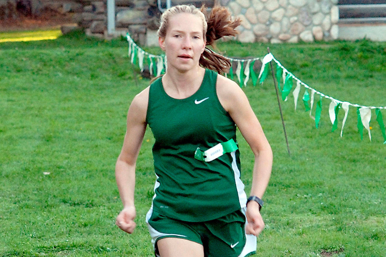 Keith Thorpe/Peninsula Daily News
Lauren Larson of Port Angeles nears the finish line to win the girls cross-country race in a three-way competition with Olympic and North Mason on Wednesday at Lincoln Park in Port Angeles.