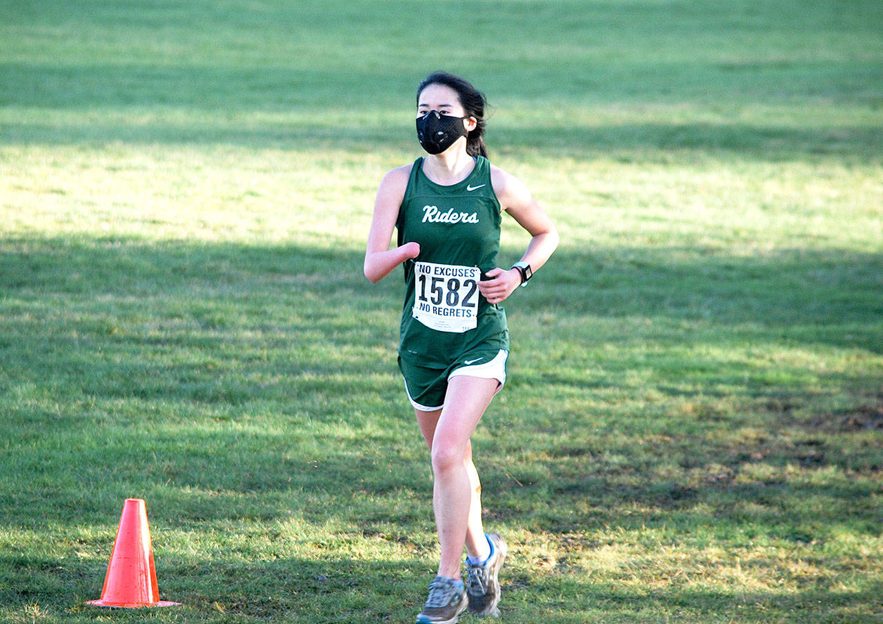 Port Angeles senior cross country runner Kathryn Guttormsen competes at Klahowya on Saturday. It was the first prep sports competition since the COVID-19 pandemic shut down all prep sports last March. (Photos by Rodger Johnson)