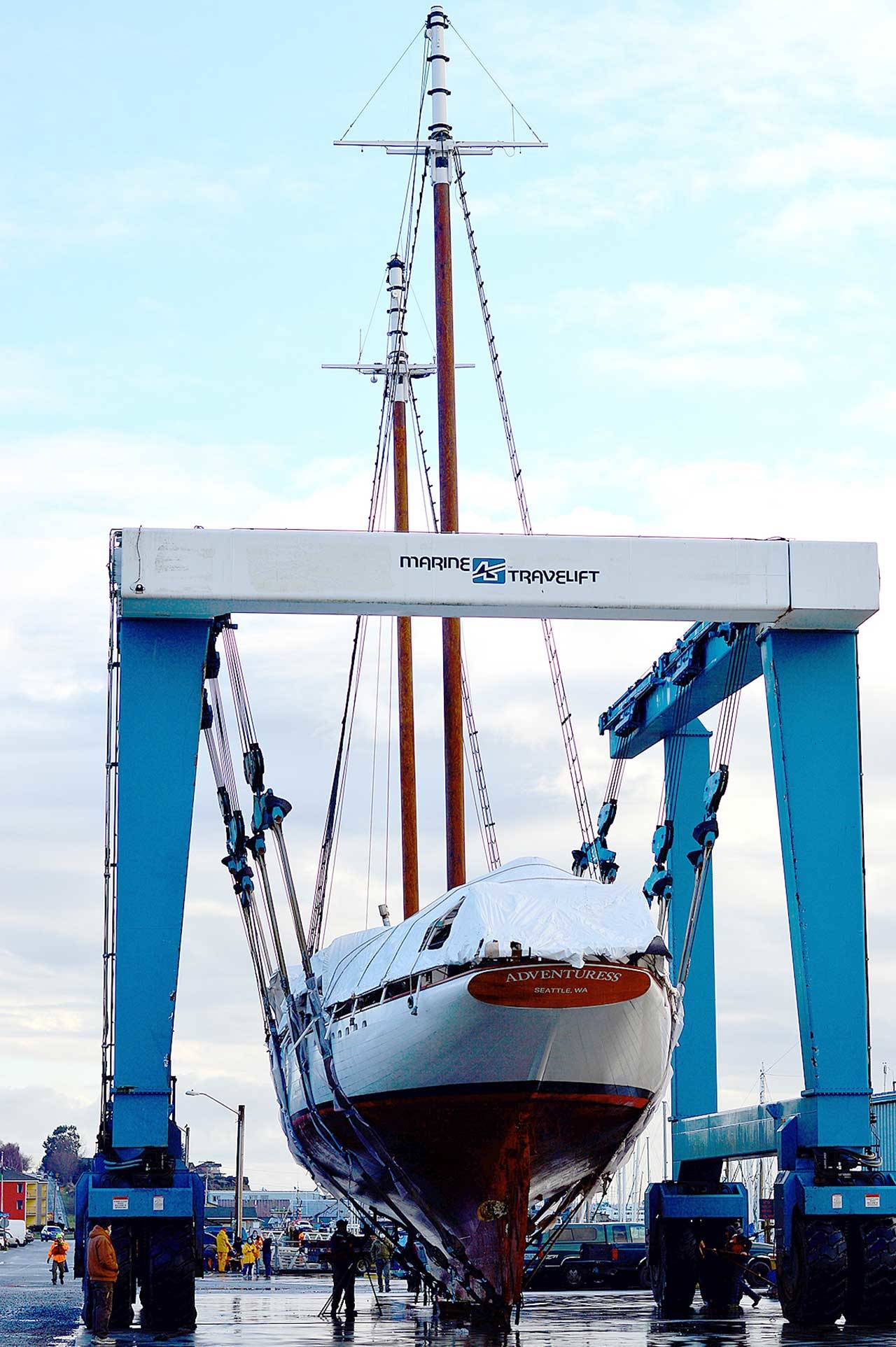The Adventuress, a 108-year-old National Historic Landmark and nonprofit educational ship, was lifted into the Port Townsend Boat Haven on Monday morning. The schooner will receive her routine Coast Guard hull inspection and have her bottom painted. (Diane Urbani de la Paz/Peninsula Daily News)