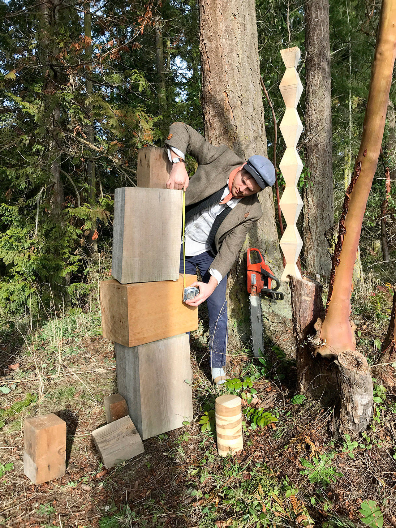 Jonah Trople of Port Townsend, working with wood outside his studio, has been chosen to create sculptural “art markers” for the city’s designated Creative District. (Port Townsend Main Street Program)