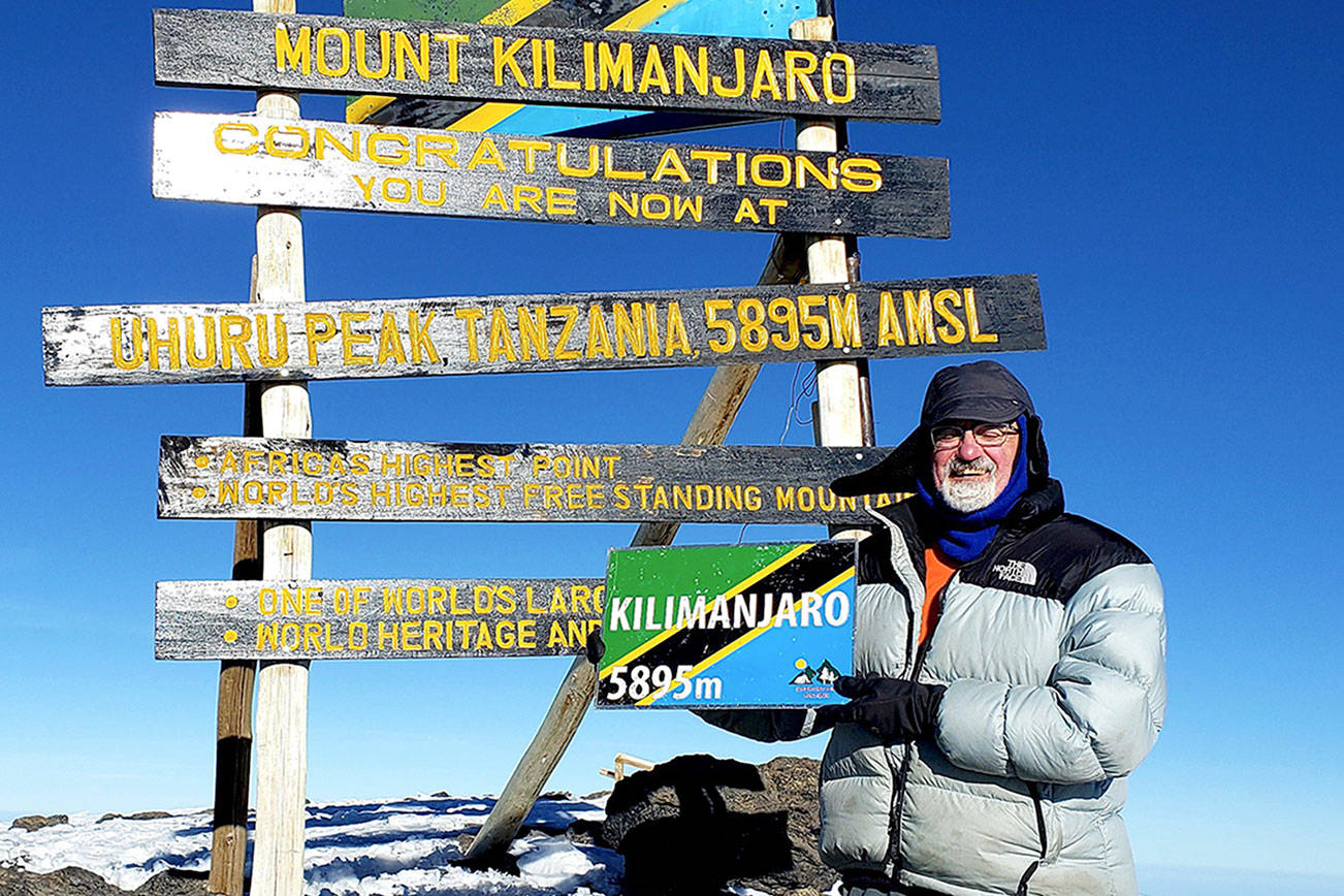 Port Angeles resident Hal Force stands at the summit of Tanzania's Mount Kilimanjaro (19,341 feet), Africa's highest peak and the fourth-tallest mountain in the world. (Photo courtesy Hal Force)