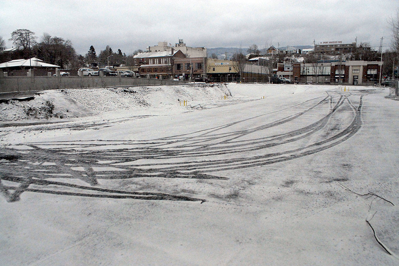 Tire tracks in the snow are present at the site of a future luxury hotel planned by the Lower Elwha Klallam Tribe in downtown Port Angeles. (Keith Thorpe/Peninsula Daily News)