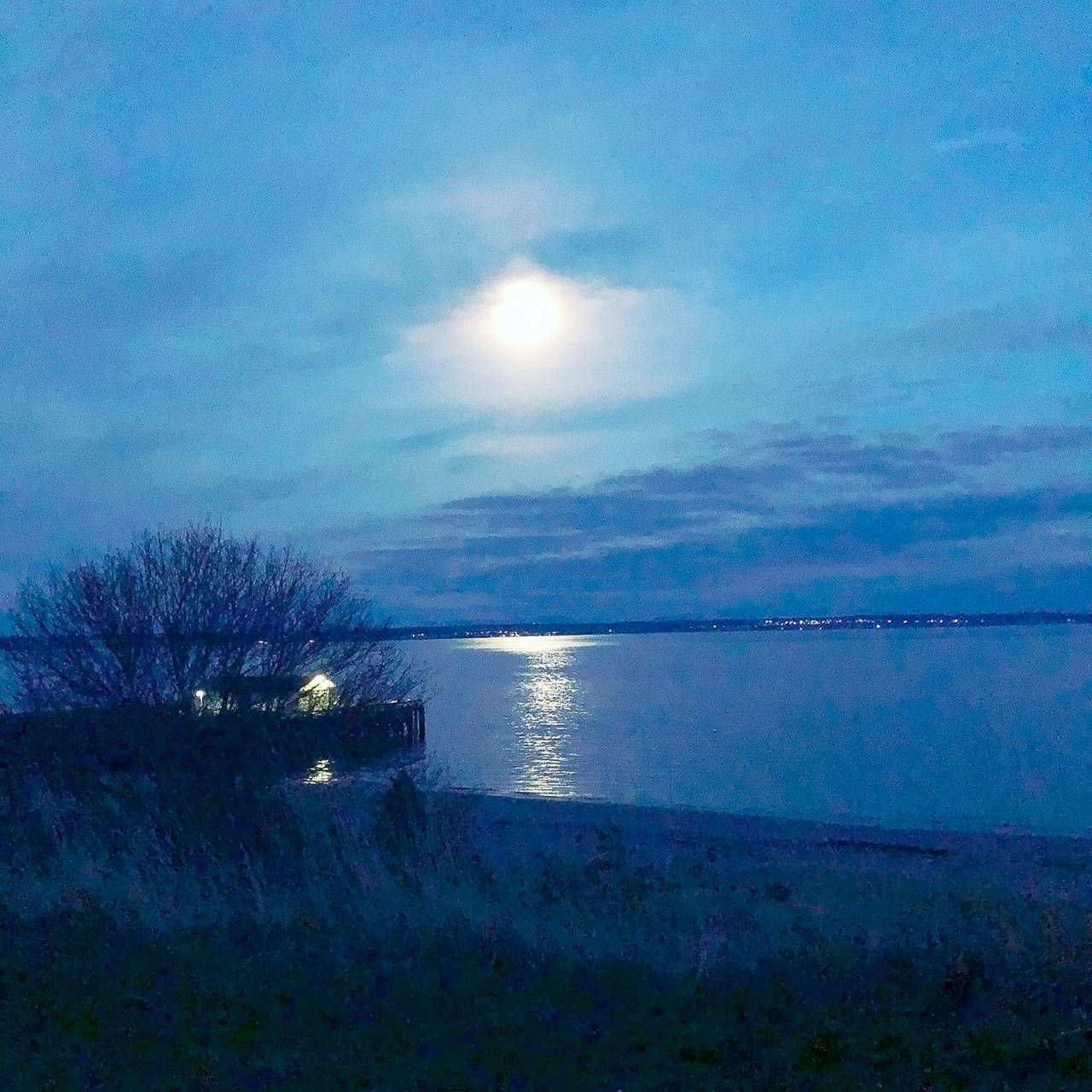 January’s full moon lights the Salish Sea at Fort Worden State Park. (Diane Urbani de la Paz/Peninsula Daily News)