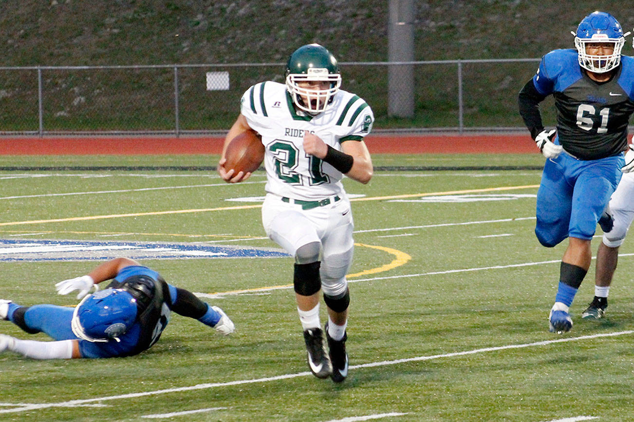 Port Angeles' Daniel Cable ran for 133 yards in this 2019 contest against Olympic. (Mark Krulish/Kitsap News Group)