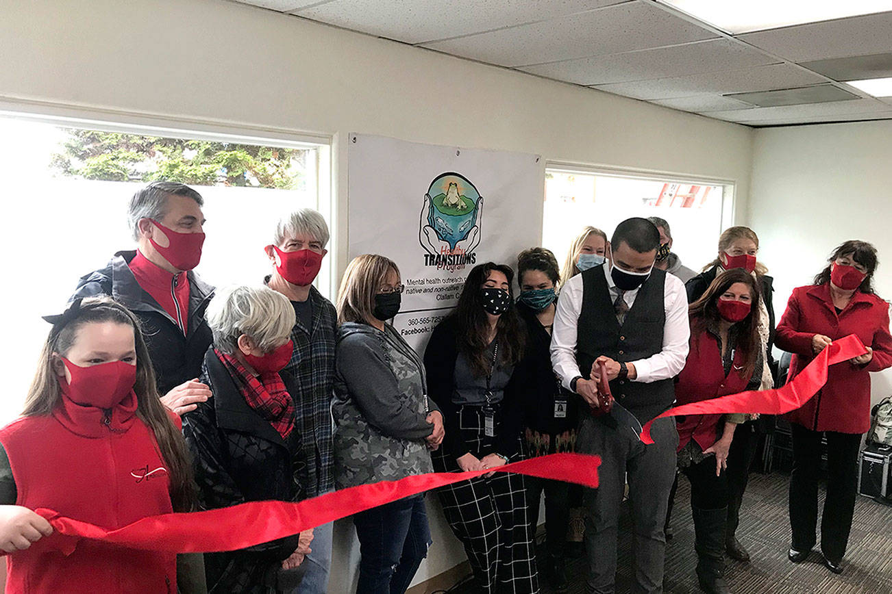 The Port Angeles Ambassadors helped with a ribbon-cutting ceremony for Healthy Transitions, 717 S. Peabody St., which will provide mental health outreach services for residents of Clallam County. From left are McKaylee Anderson, Christopher Thomsen, Edna Peterson, Steve Hargis, Kerrie Morrison, Aloma Sisco, Raelyn Bowechop, Jessica Wright, Jesse Charles, Brad Holloway, Leslie Robertson, Martha Cunningham and Julie Hatch.