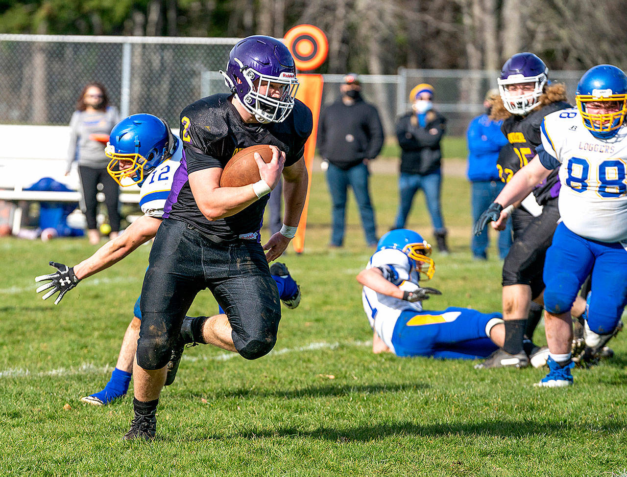Quilcene’s Bishop Budnek Scampers for a 55 yard touchdown run during a Saturday home game against the Crescent Loggers. (Steve Mullensky/for Peninsula Daily News)