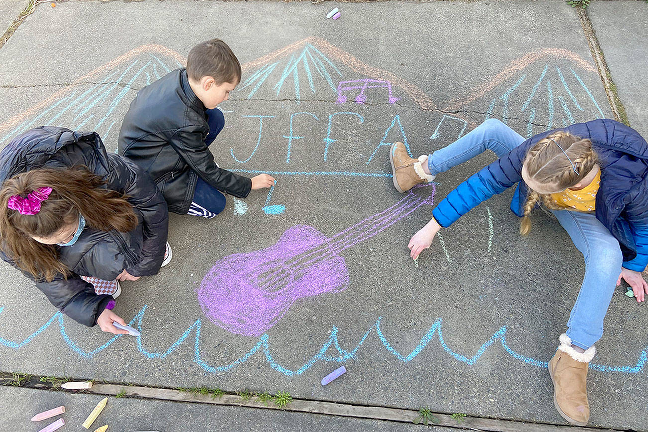 Warming up for Saturday's "Chalk It Up!" event are Cate Chance, 11, left, Lucas Chance, 7, and Sarah Butterworth, 10, all of Port Angeles. (Photo courtesy Juan de Fuca Foundation for the Arts)