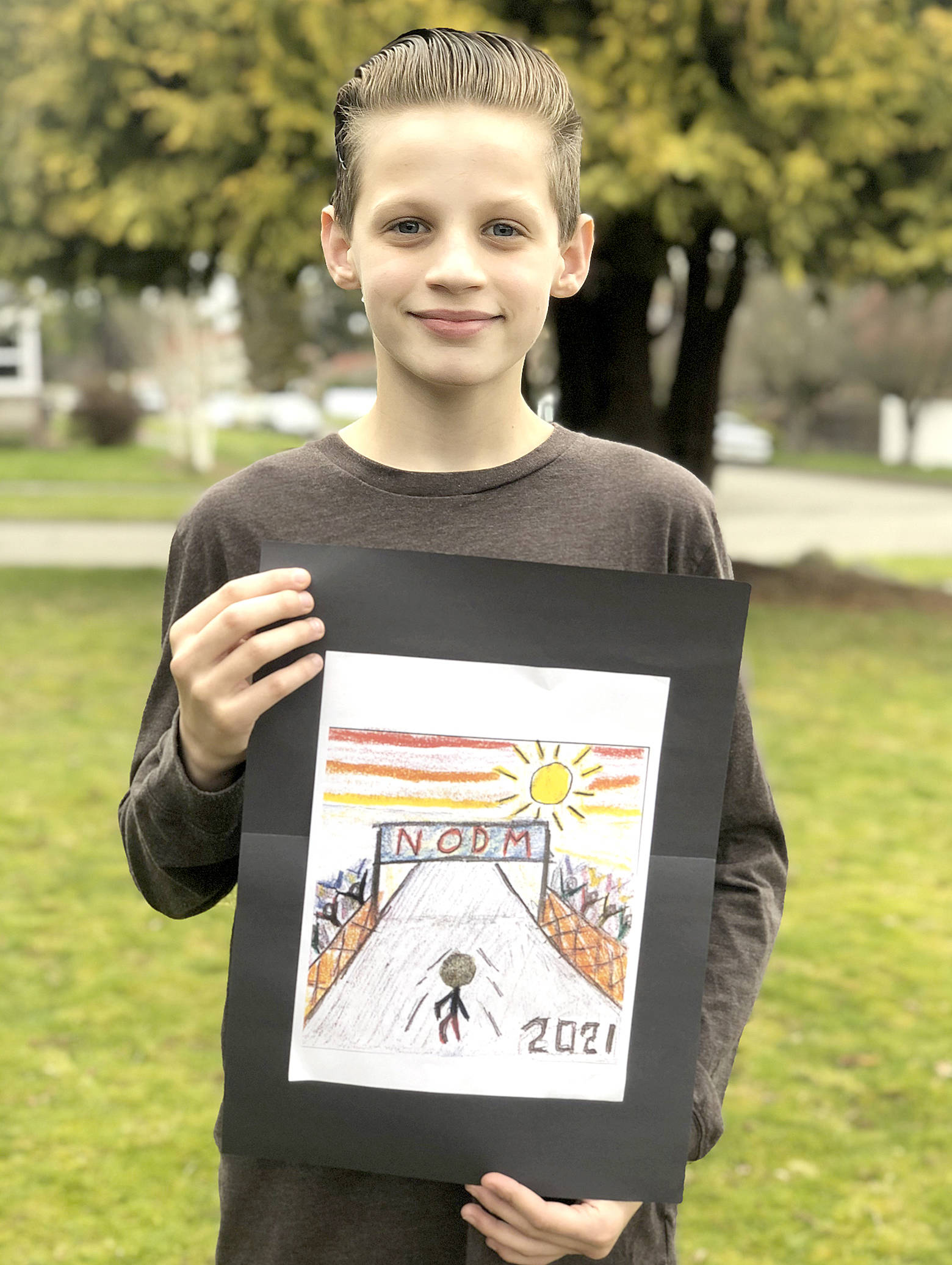 North Olympic Discovery Marathon
John Ruddell, 12, is the grand prize winner of the North Olympic Discovery Marathon kids medal design contest.