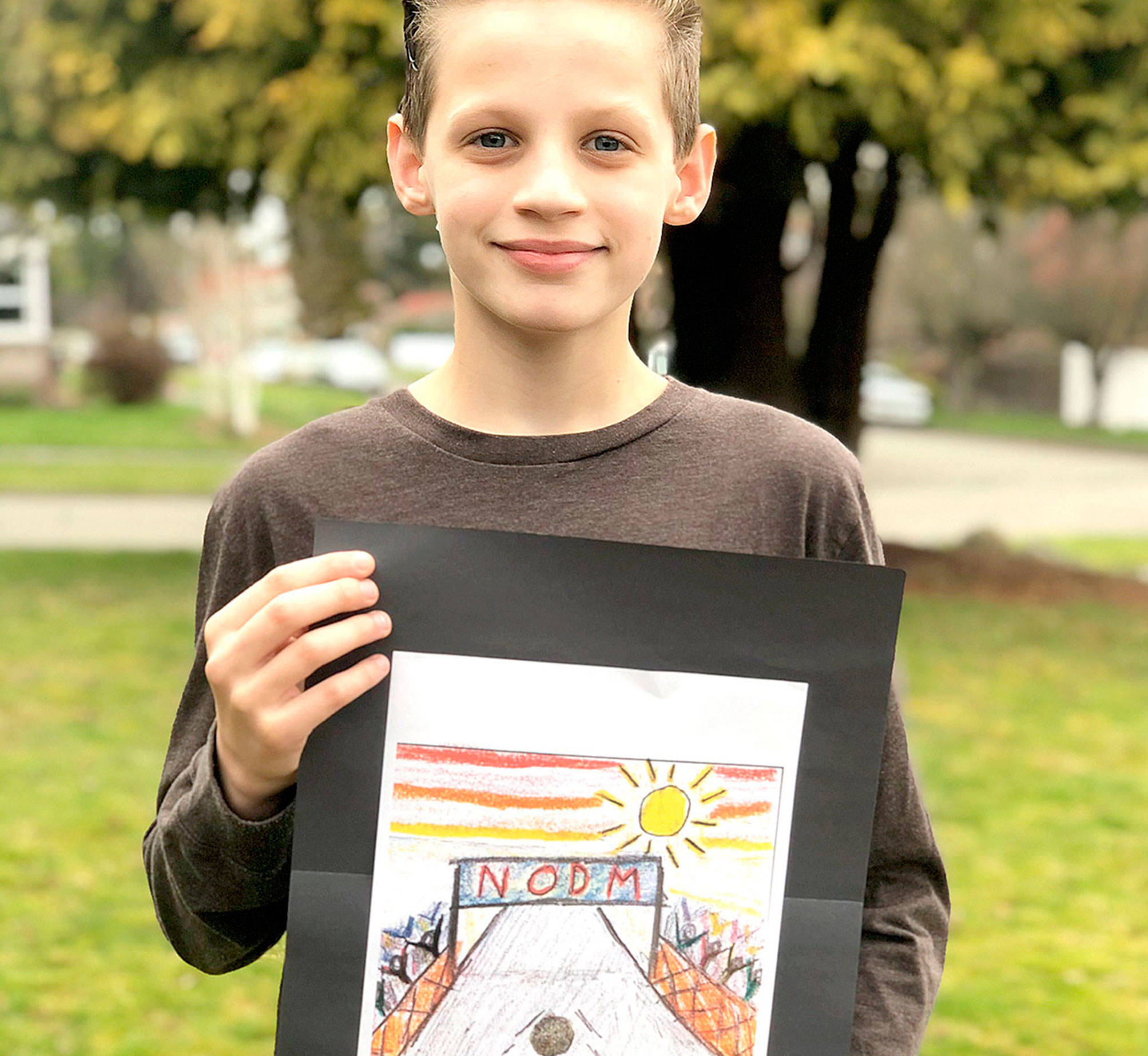 North Olympic Discovery Marathon
John Ruddell, 12, is the Grand Prize winner of the North Olympic Discovery Marathon kids medal design contest.