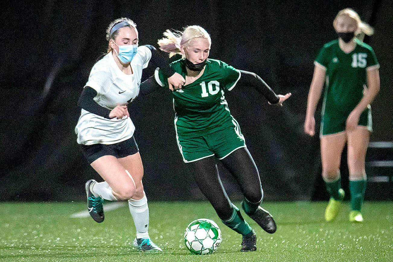 Jesse Major/for Peninsula Daily News
Port Angeles' Millie Long (10) had two goals for the Roughriders Tuesday night against Klahowya in a 3-1 win over a strong team. In the background is the Riders' Paige Mason (15).