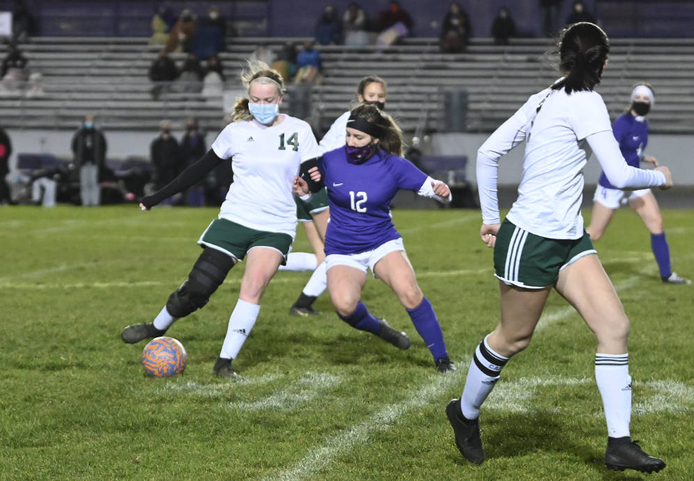 Michael Dashiell/Olympic Peninsula News Group
Port Angeles' Anna Petty, left, is defended by Sequim's Natalya James as Petty passes to teammate Bailee Larson.