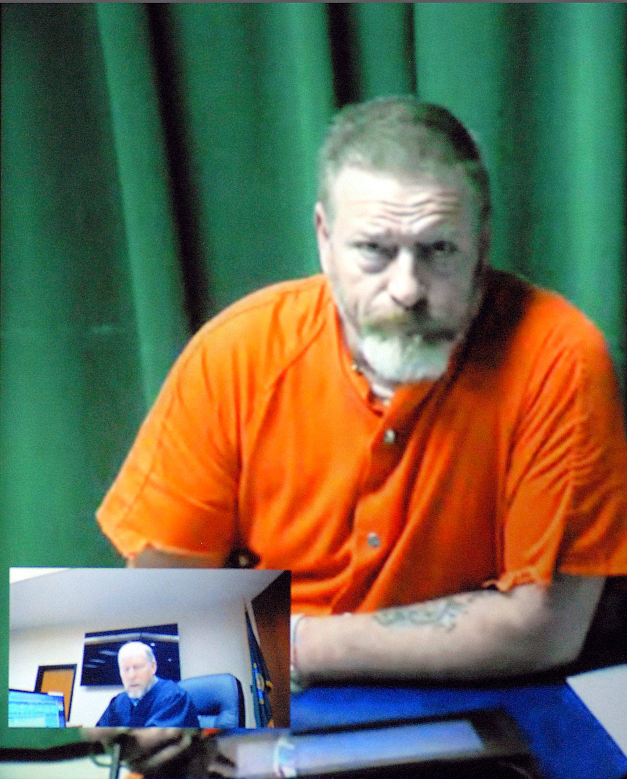 <strong>Keith Thorpe</strong>/Peninsula Daily News
Dennis Bauer makes his first video appearance in Clallam County Superior Court in Port Angeles on Friday after he was arrested Thursday.