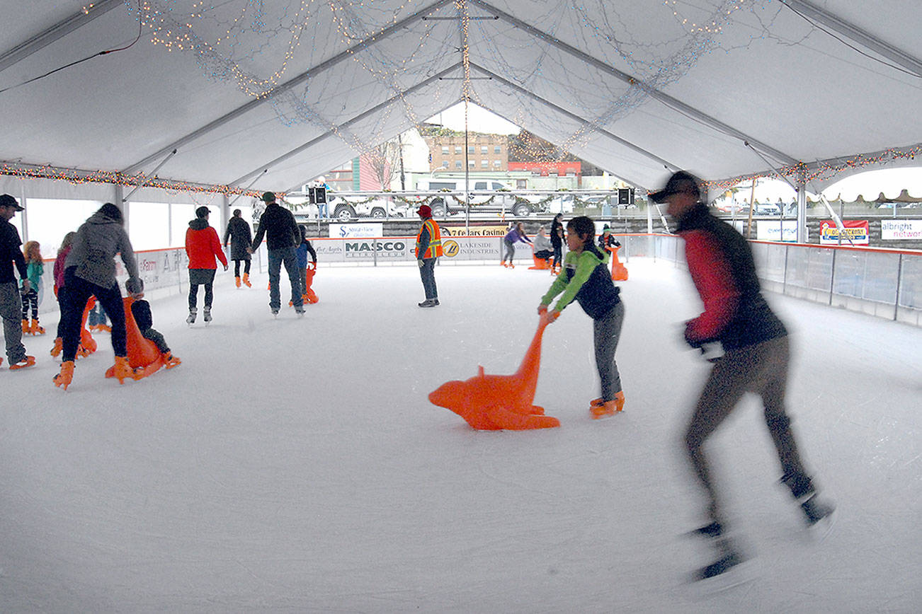 Keith Thorpe/Peninsula Daily News
Skaters make their way around the rink in January 2020 at the Port Angeles Winter Ice Village.