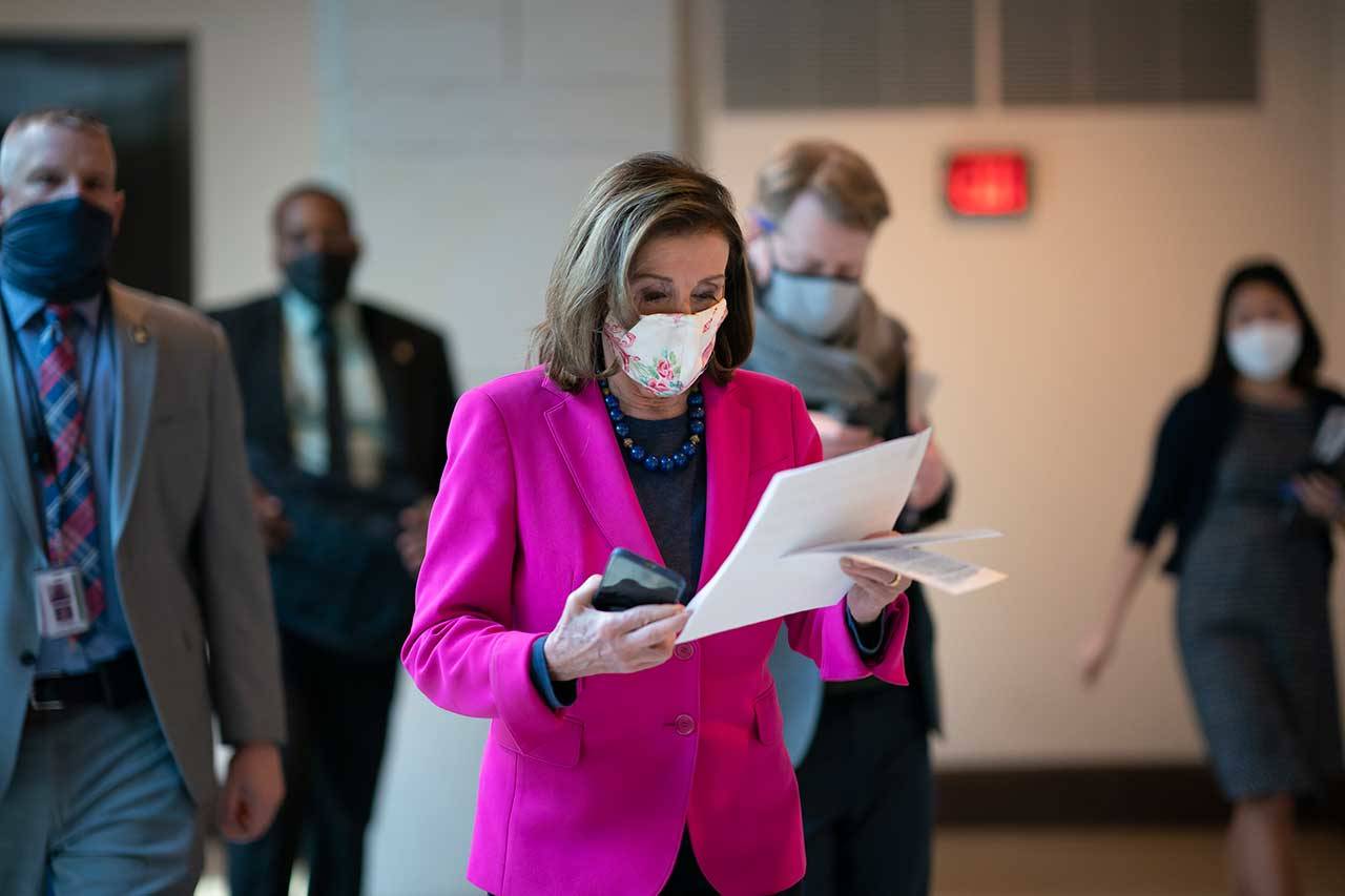 Speaker of the House Nancy Pelosi, D-Calif., walks to a news conference as the Democratic-led House is poised to pass a bill that enshrines protections in the nation’s labor and civil rights laws for LGBTQ people, a top priority of President Joe Biden, at the Capitol in Washington, Thursday, Feb. 25, 2021. (J. Scott Applewhite/The Associated Press)