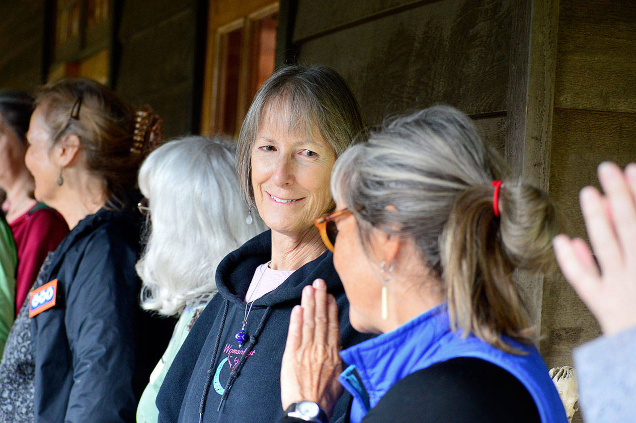 Womanfest board member Barbara Wise talks with the fall retreat participants at Lake Crescent in 2016. The retreat will return this September, organizers hope. (Diane Urbani de la Paz/Peninsula Daily News)