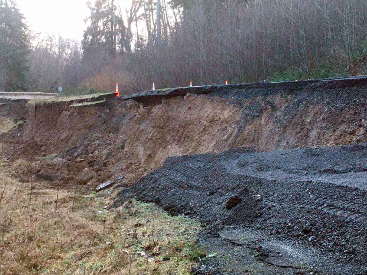 Photo courtesy of WSDOT
 State Highway 112 at milepost 36.9, where the highway has dropped more than 13 feet due to roadway settlement.