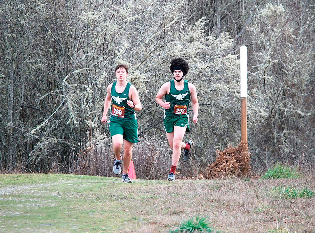 Port Angeles cross country runners from left, Caleb McLarty and Brock Tejeda on the course in Sequim. (Photo courtesy of Rodger Johnson)