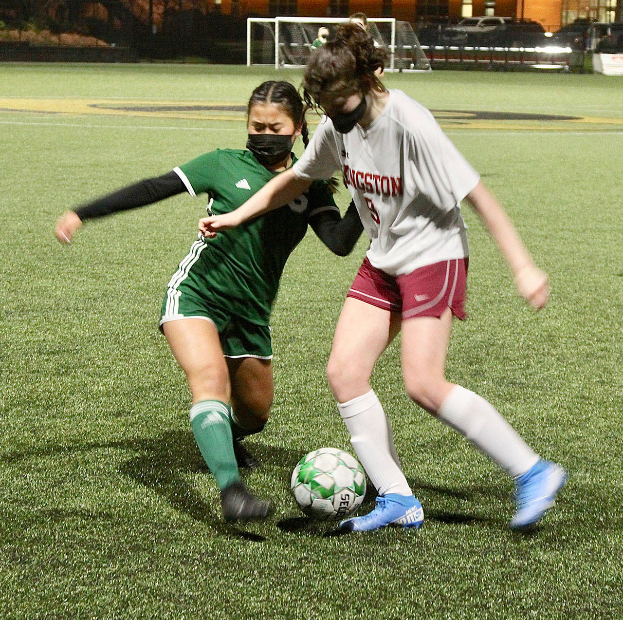 <strong>Dave Logan</strong>/for Peninsula Daily News
Port Angeles’ Lily Sanders (6) tries to take the ball away from Cora Caidis of Kingston during Monday’s match at Wally Sigmar Field. The Roughriders won 4-1.