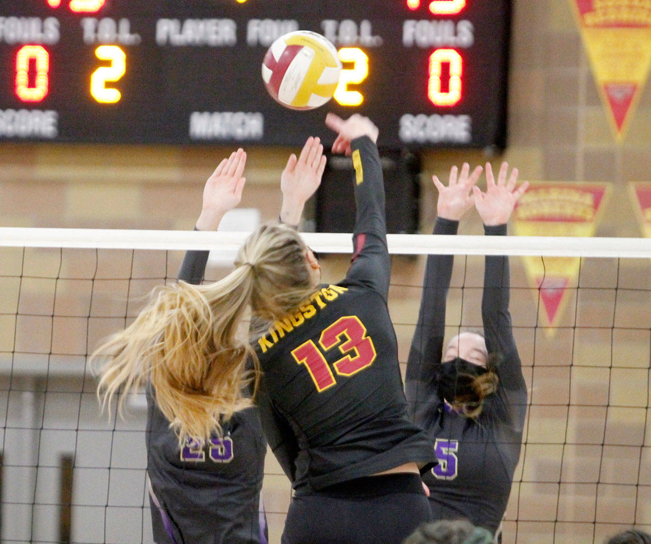 Sequims Amanda Weller and Joelene Vaara team up for a block during a contest with Kingston. (Mark Krulish/North Kitsap Herald)