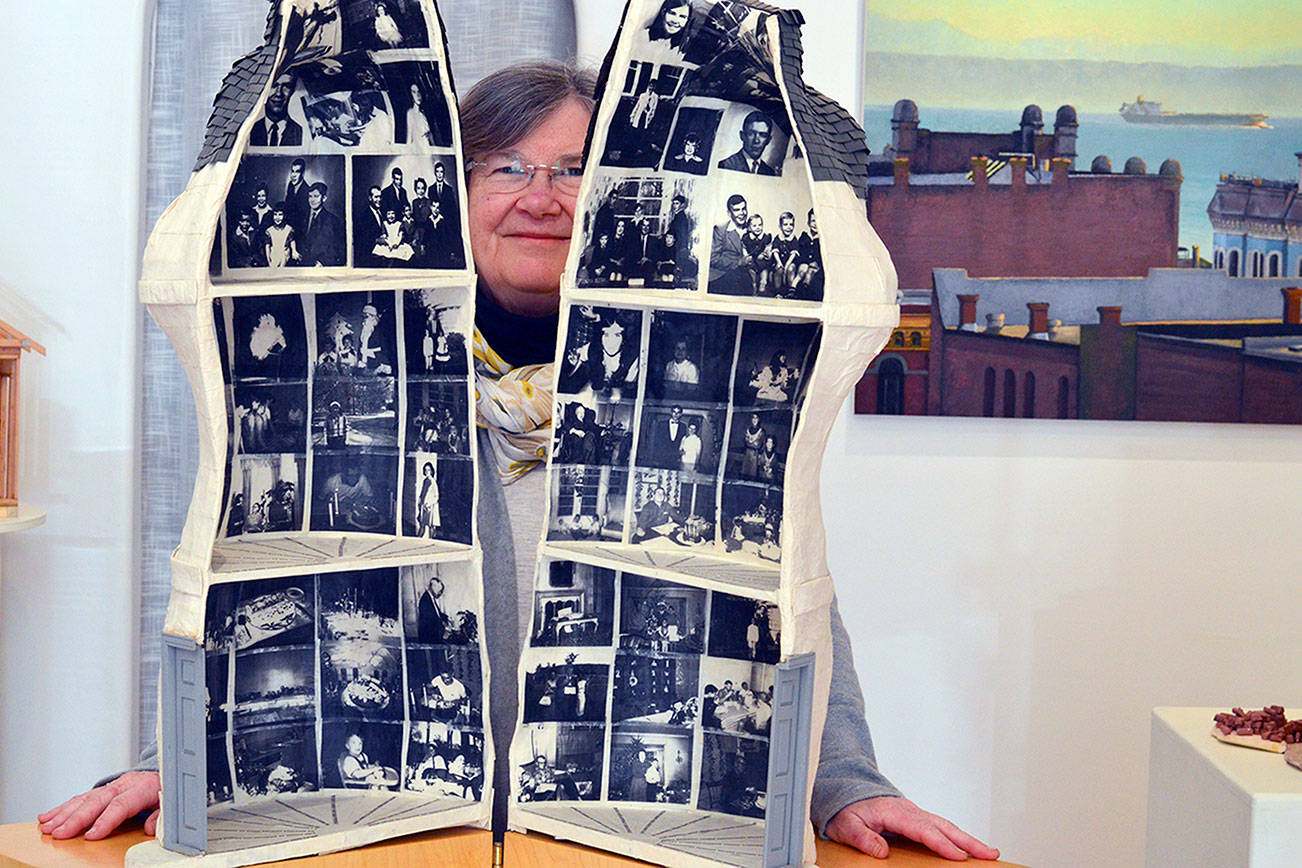 Mary O'Shaughnessy filled a dressform with photographic images from her life to create "The Home Within," a top award winner in the "Spirit of Home" exhibition. The show is on display at the Grover Gallery in downtown Port Townsend through March 28.