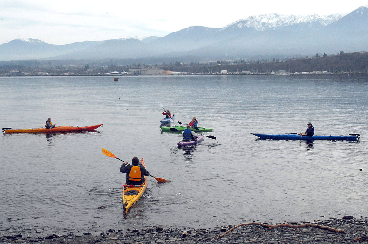 Ben Allen of Chiniak, Alaska, front, paddles out to join members of his extended family, from left, Aiya Allen, 12, and Miya Allen, 11, both of Chiniak, along with Madison Critchfield and Nancy Sharp, both of Port Angeles, and Raechel Allen of Chiniak, during a weekend kayak outing on Port Angeles Harbor. The group set out on their excursion from Sail and Paddle Park on Ediz Hook. (Keith Thorpe/Peninsula Daily News)