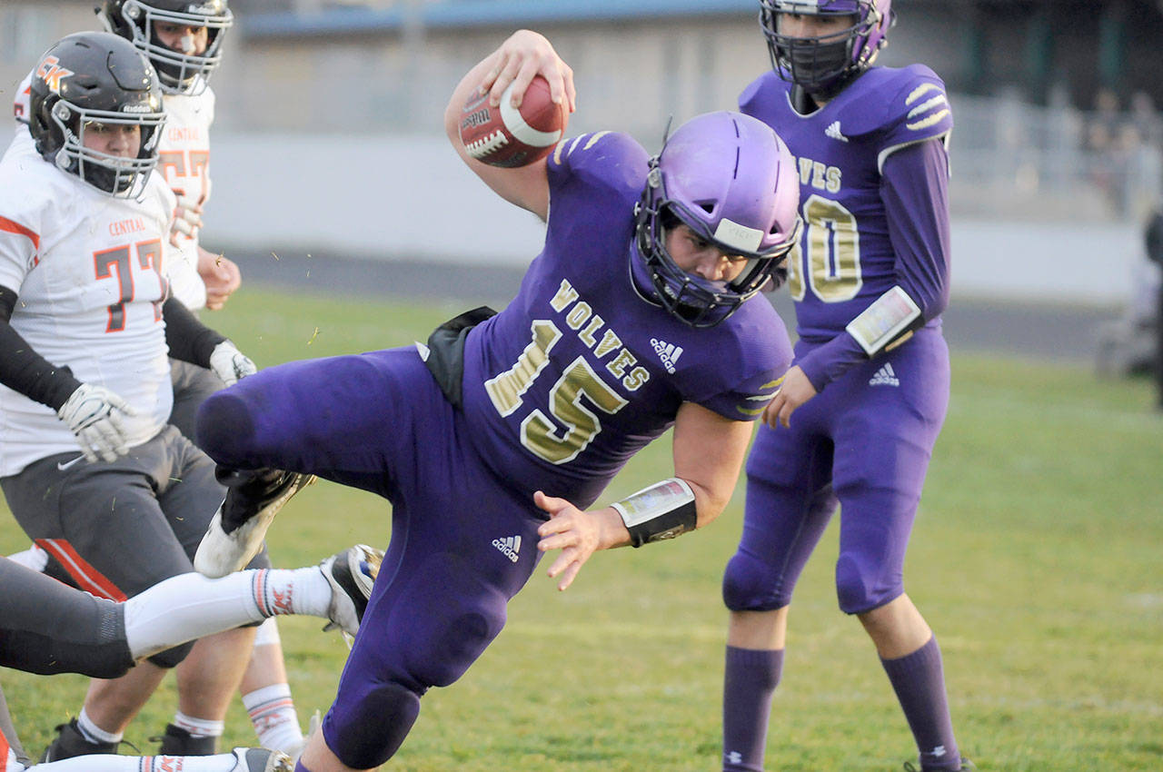 Sequims Taig Wiker dives for yardage during the Wolves 38-22 win over Central Kitsap.
Michael Dashiell/Olympic Peninsula News Group