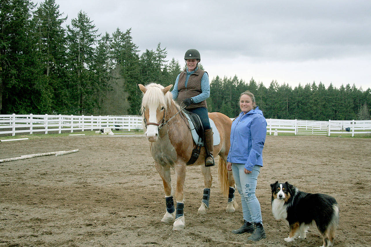 After retiring in June last year, Amy Greenbaum, on BelClaire, became a working student — someone who does barn chores — for Fédération Équestre Internationale competitor, trainer and instructor Becky Cushman with Casey at Paradigm Sporthorse in Port Townsend. (Karen Griffiths/for Peninsula Daily News)