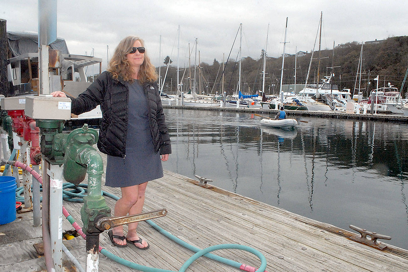 Keith Thorpe/Peninsula Daily News
Port Angeles Yacht Club Commodore Erika Hansen-Dahlin stands on the Port Angeles Boat Haven fuel dock, a feature destined to be replaced as part of $2.1 million in improvements approved by the Port of Port Angeles.