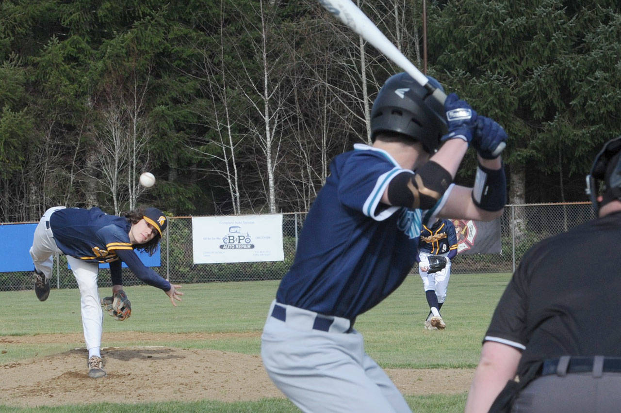 Spartan pitcher Carter Windle delivers the pitch to a NW Christian batter Friday afternoon at Fred Orr Field in Beaver where Forks defeated the Wolverines. (Photo by Lonnie Archibald./for Peninsula Daily News)