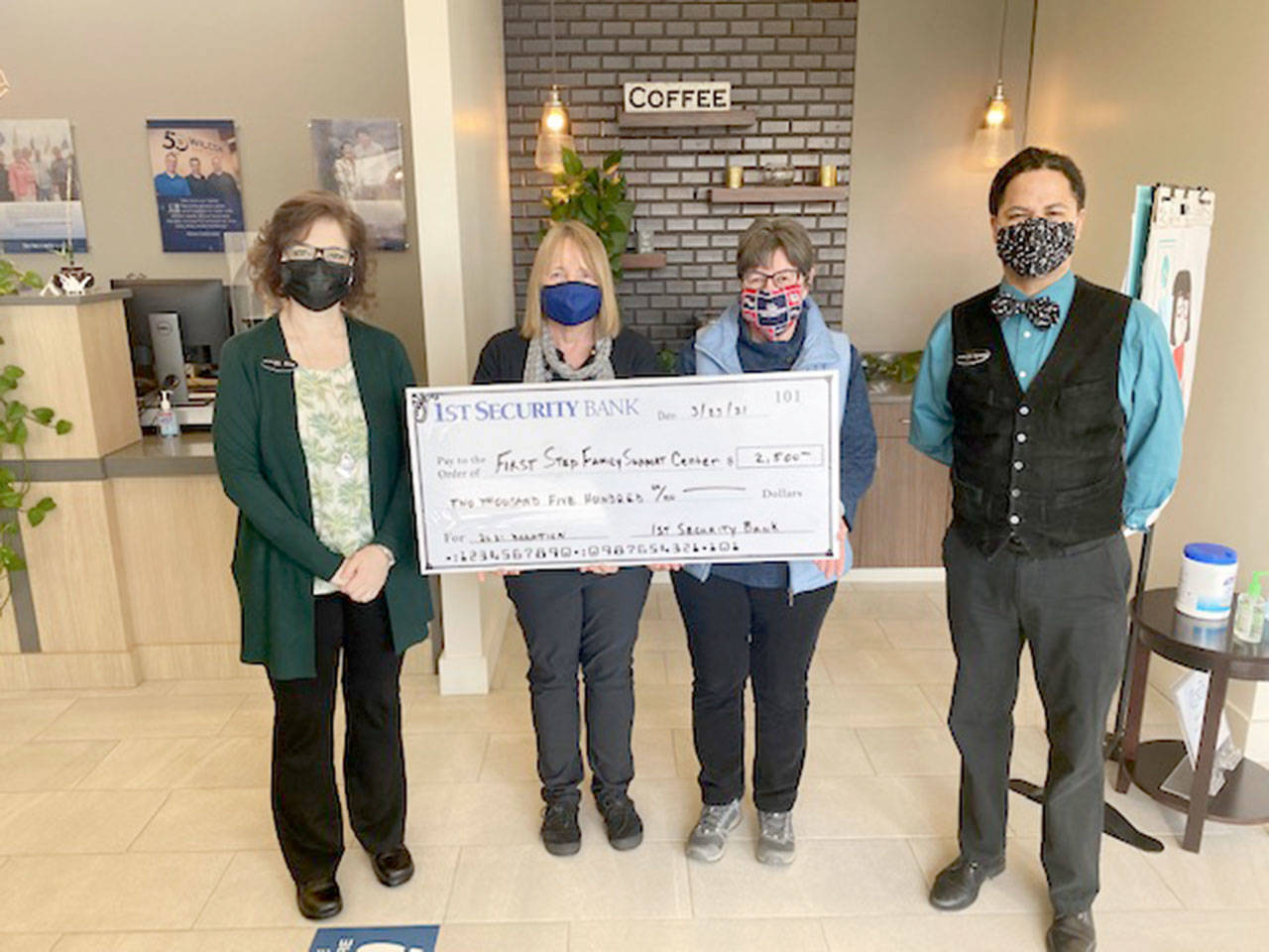 The Port Angeles branch of 1st Security Bank recently donated $2,500 to First Step Family Support Center. The Port Angeles-based nonprofit promotes the healthy development of children and families on the North Olympic Peninsula by building strong families. Some of its services include maternity support, parental coaching and assistance, and drop-in centers that help with clothing, diapers, formula, access to phones and other services. Pictured, left to right, are Elisa Simonsen, Venita Lynn, Kathy Murphy Carey and Tyrone Beatty.