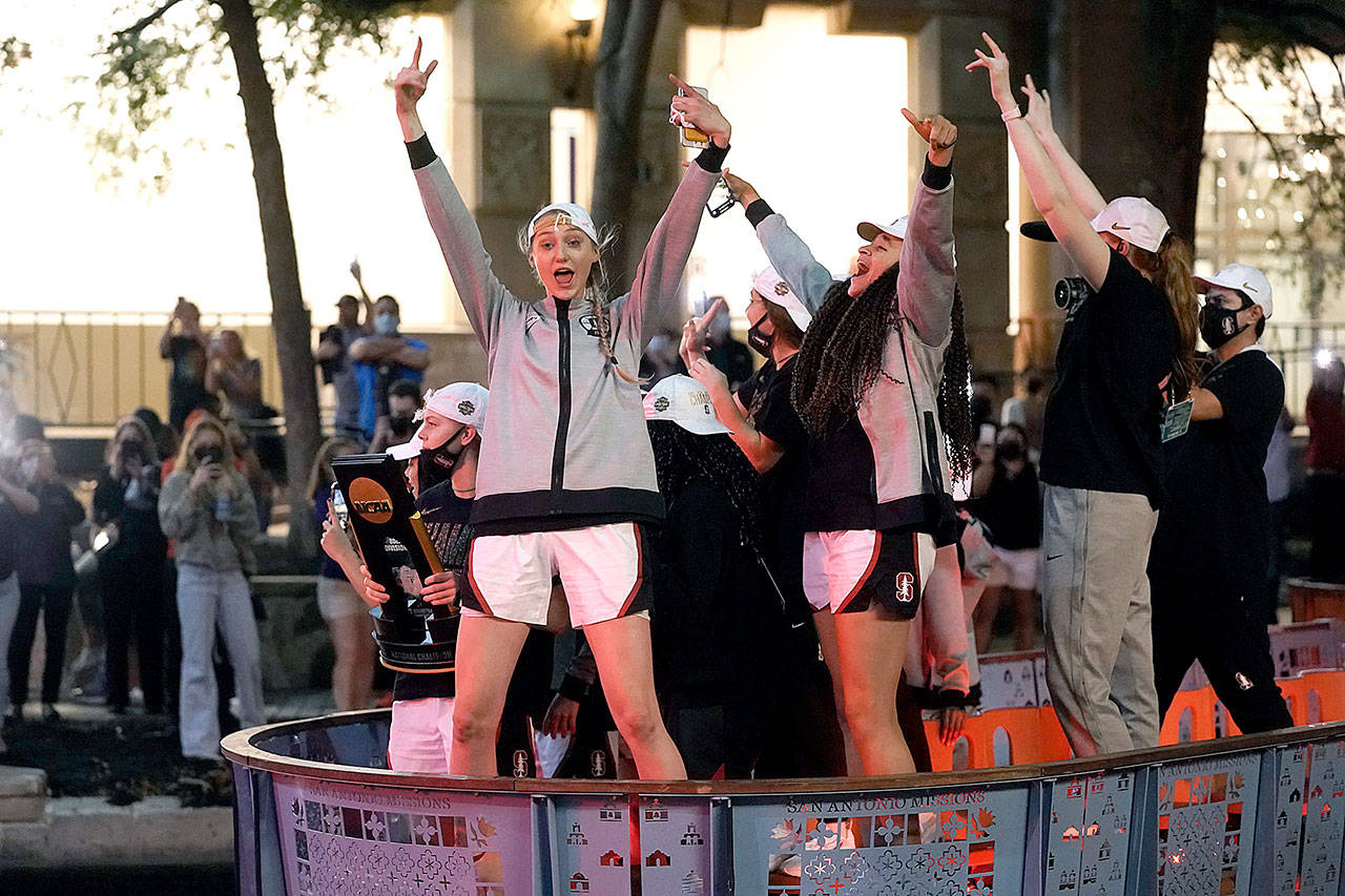 Stanford players celebrate on the River Walk after defeating Arizona 54-53 in the championship game of the women’s Final Four NCAA college basketball tournament on Sunday at the Alamodome in San Antonio. (Morry Gash/The Associated Press)