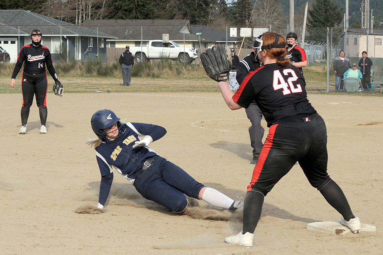 Lonnie Archibald/for Peninsula Daily News
Forks' Kyra Neel slides safely into third during the second game of a doubleheader against Raymond on Tuesday at Tillicum Park in Forks.