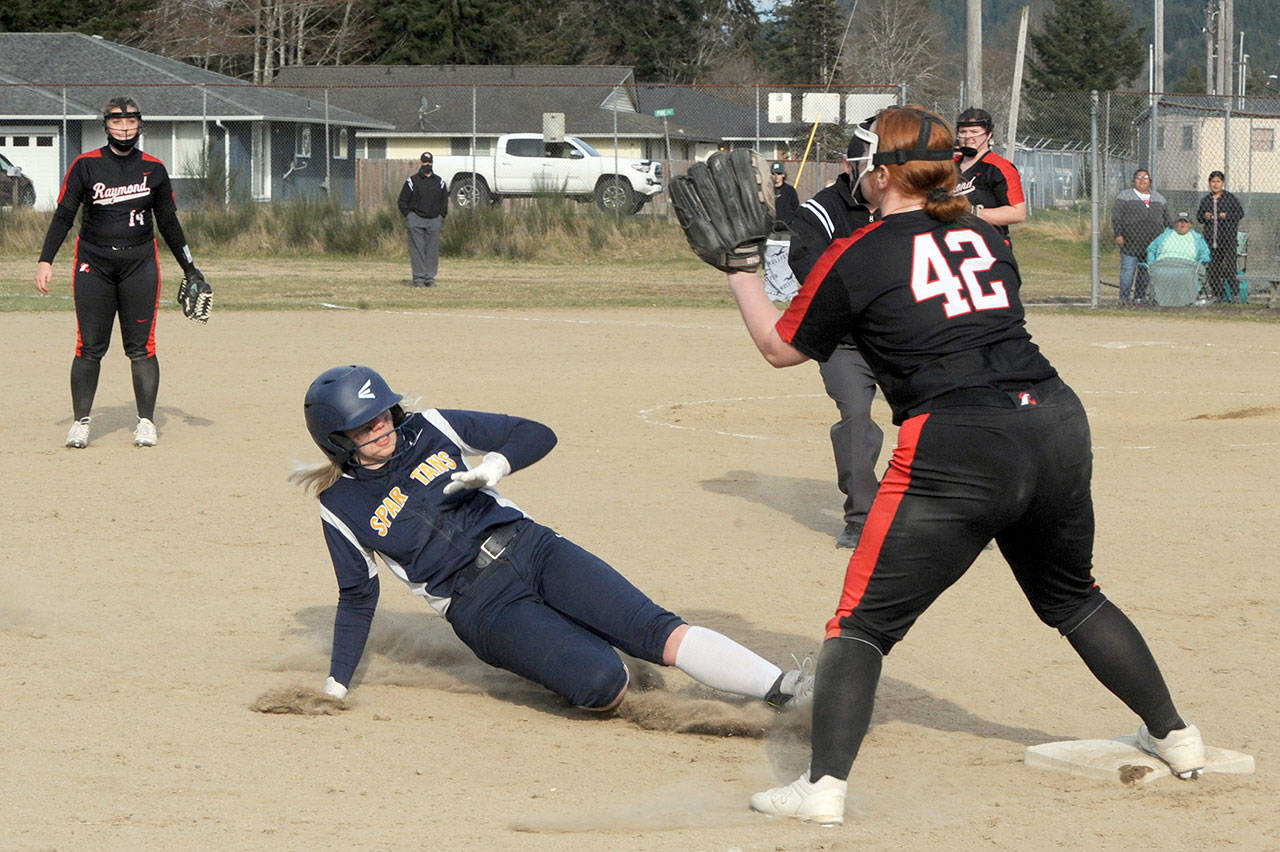 Forks’ Kyra Neel slides safely into third during the second game of a doubleheader against Raymond on Tuesday at Tillicum Park in Forks. (Lonnie Archibald/for Peninsula Daily News)