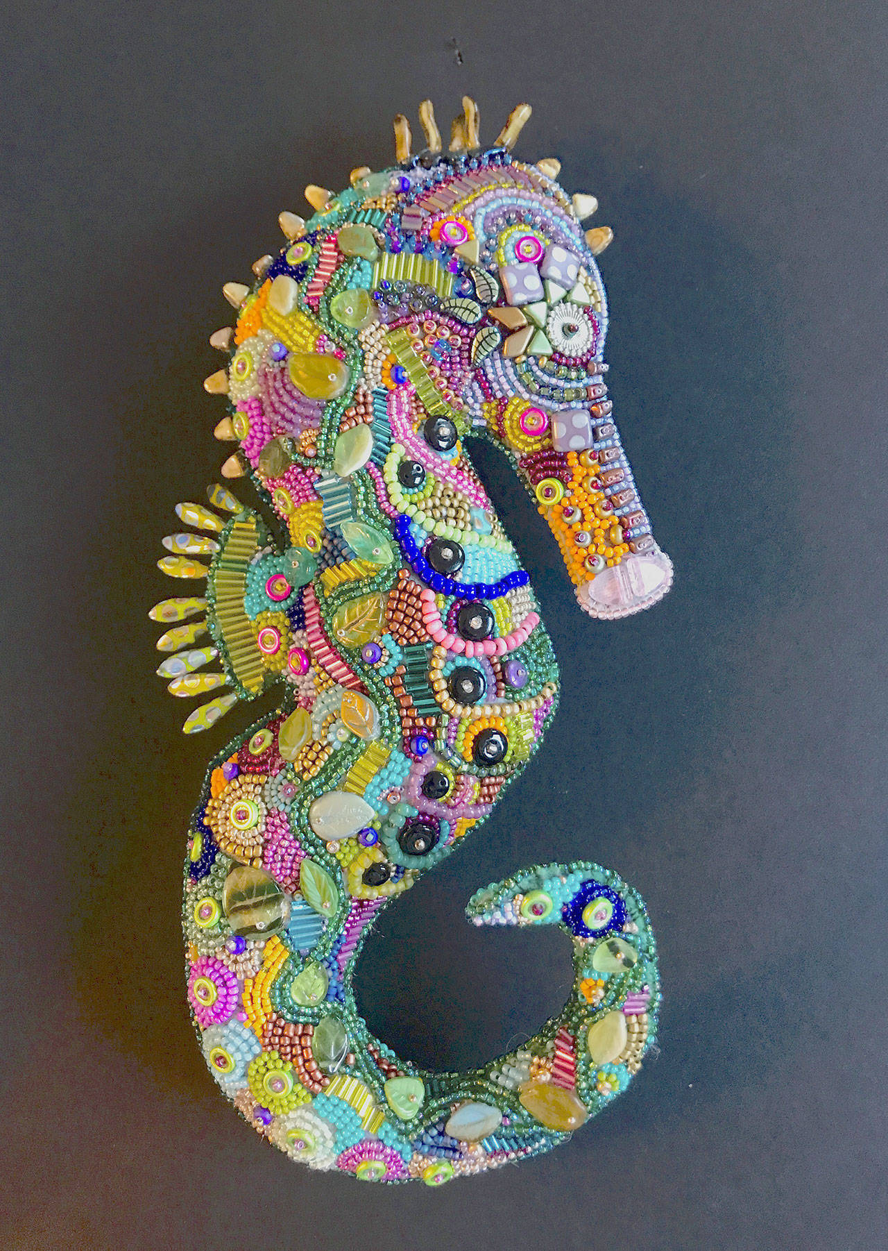 Seahorse, by Pat Herkal is among the textile artworks on display at the Northwind Art Grover Gallery.
