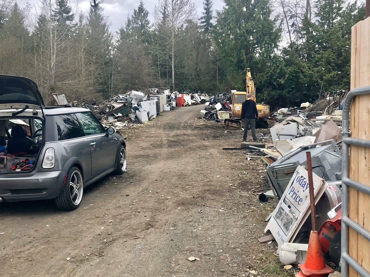 Tons of metal scrap are being hauled away from Midway Metals, avoiding enforcement action against its Port Orchard owner. (Paul Gottlieb/Peninsula Daily News)