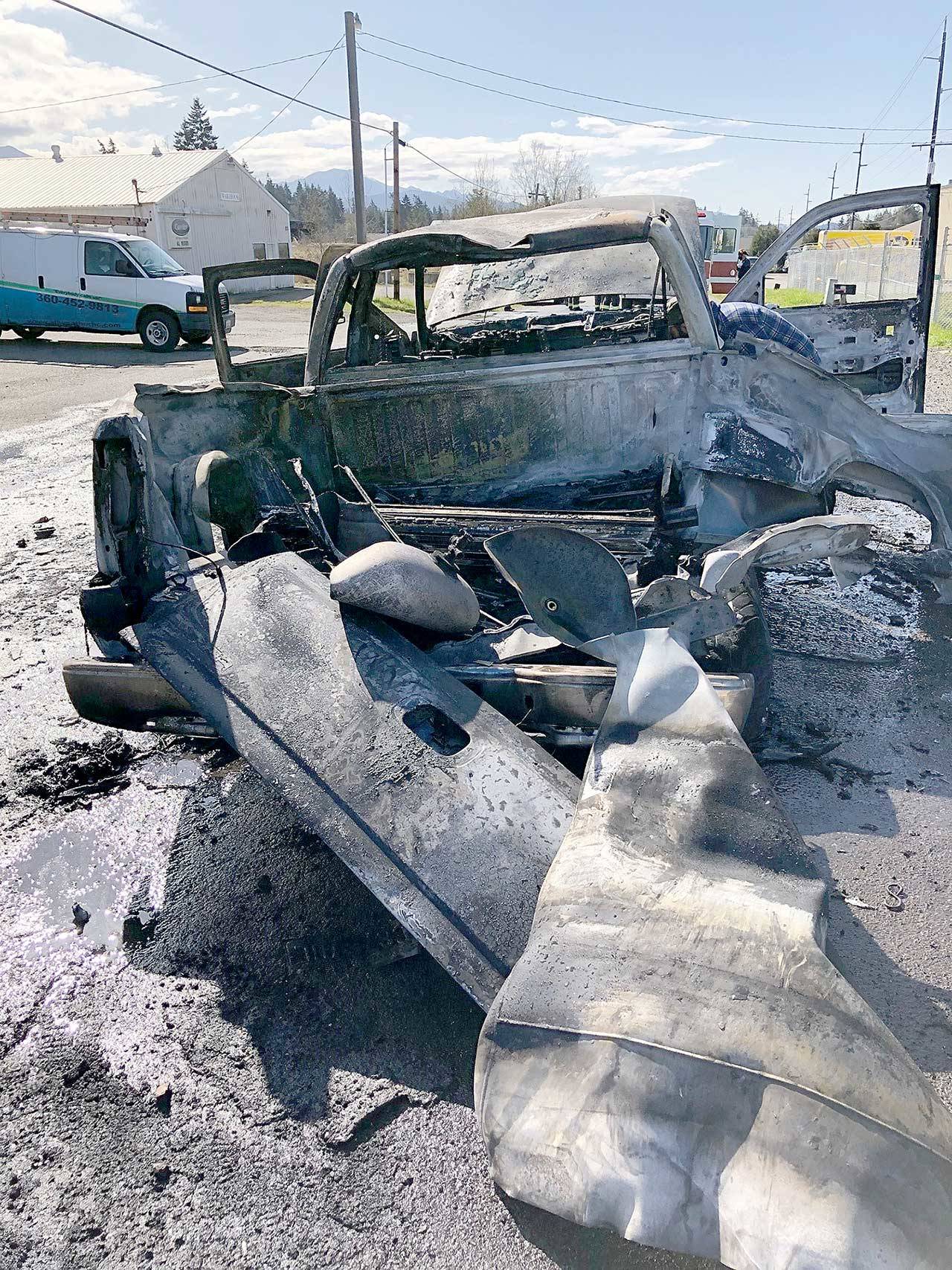 A GMC Sierra burned and two propane tanks exploded on Sunday on Kemp Street behind the IGS grocery store on U.S. Highway 101 east of Port Angeles. (Clallam County Fire District 2)