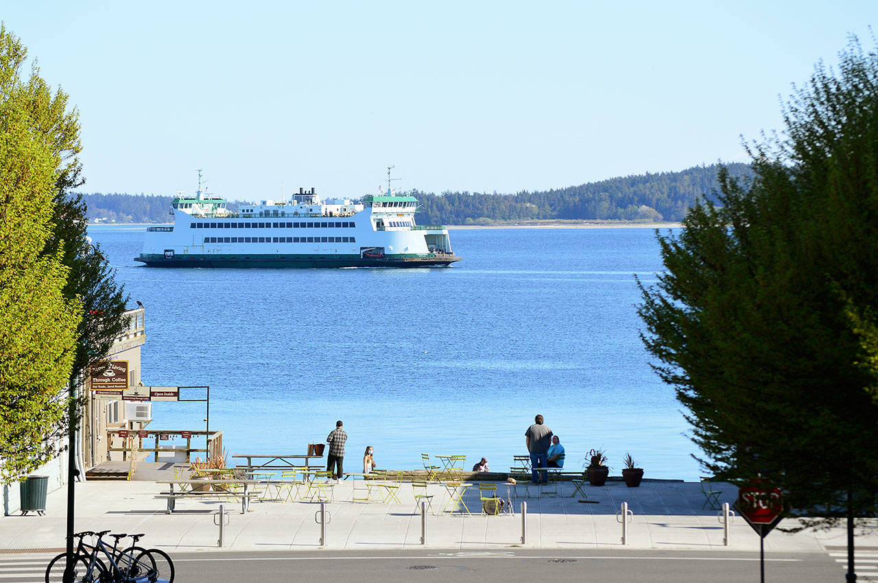 The Kennewick, a Washington State ferry, heads past Port Townsend’s Water Street on Friday afternoon. Service will stay at just one boat through June 5, unlike pre-pandemic years, when two boats sailed between Port Townsend and Coupeville starting in May. (Diane Urbani de la Paz/Peninsula Daily News)