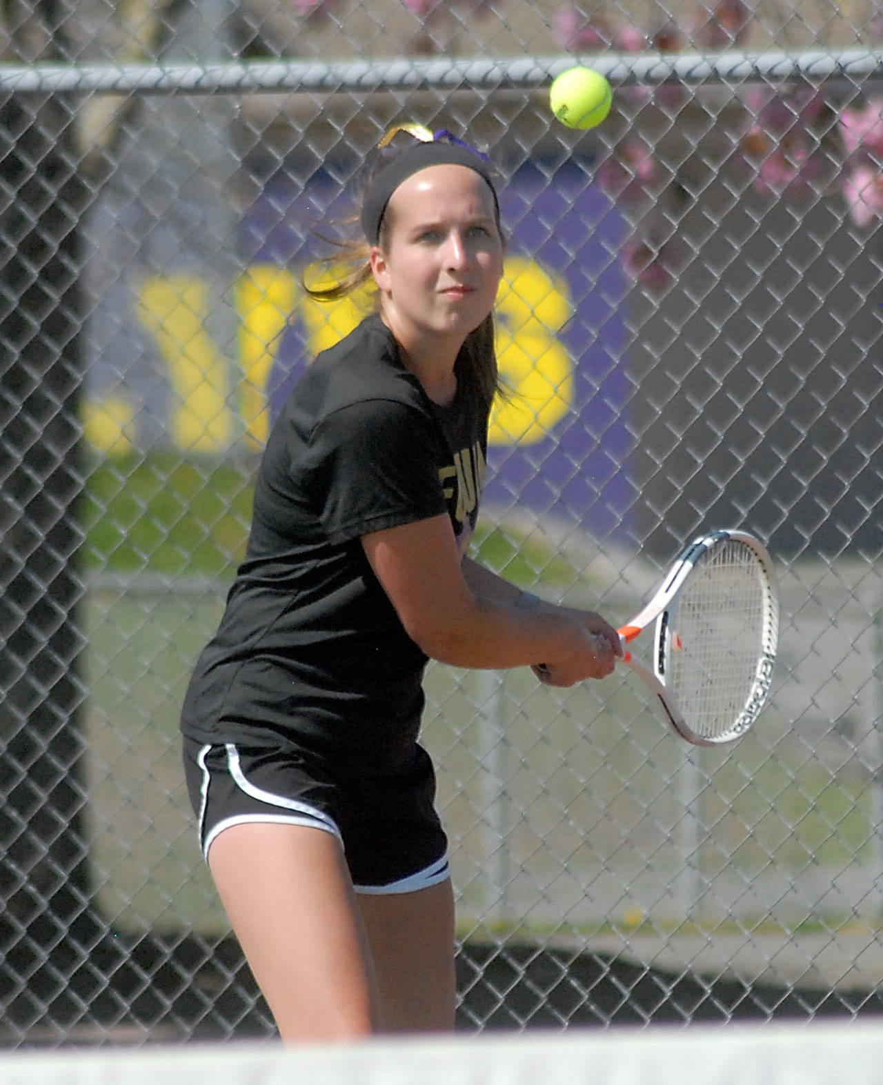 Keith Thorpe/Peninsula Daily News Sequim’s Kalli Wiker goes for the return in her match on Thursday against Port Angeles’ Liberty Lauer at Sequim High School.