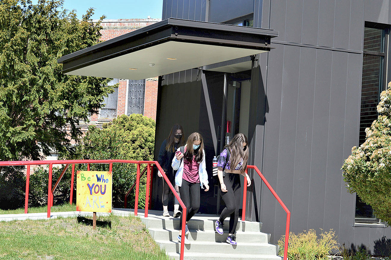 A variety of inspirational messages — the “Signs of Hope” — dot the Port Townsend High School campus, where, from left, Sage Wyatte, Jasmine Hansen and Gabby Newton head for class. (Diane Urbani de la Paz/Peninsula Daily News)