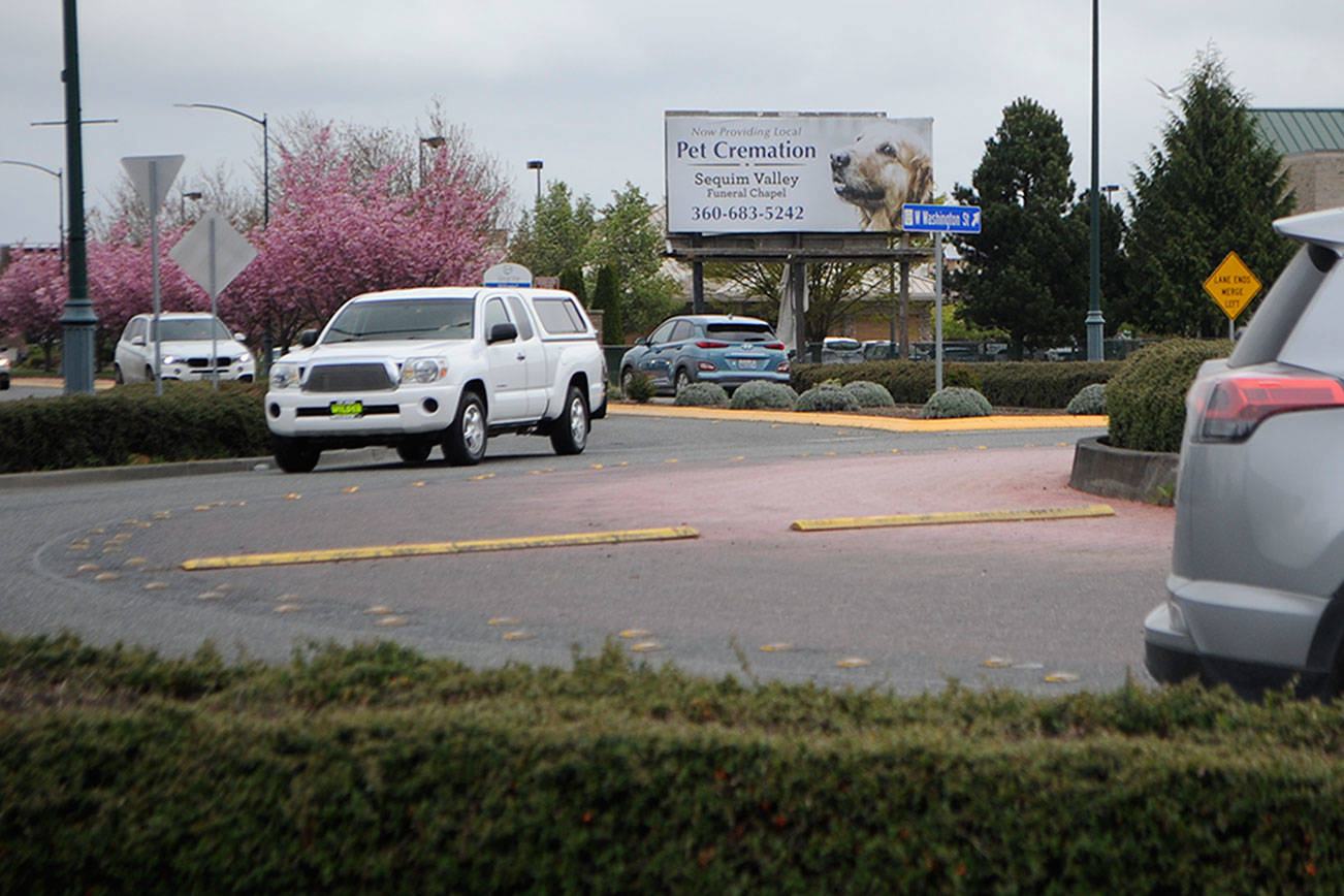 City staff plan to pave a portion of Washington Street from the Ninth Avenue roundabout to the River Round roundabout this September using a federal grant. Matthew Nash/Olympic Peninsula News Group