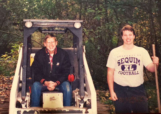 Rotarian Bryce Fish and Eagle Scout candidate Tristan Sanford take a break from their work at the Dungeness River Center in 1995. (Photo courtesy of Betty Graf)