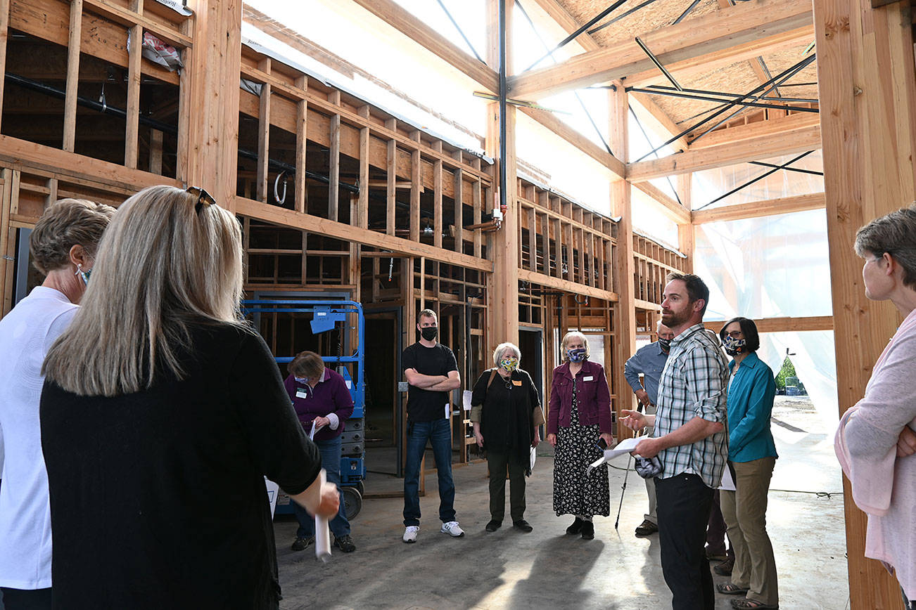 Dungeness River Audubon Center director Powell Jones, right, helps guide a tour of the center’s renovation to Sequim Sunrise Rotary Foundation board members. (Michael Dashiell/Olympic Peninsula News Group)