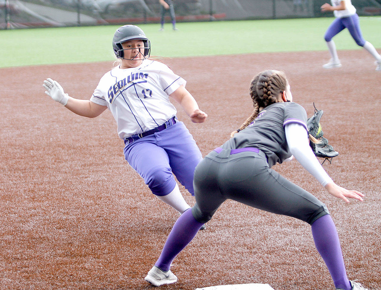 Sequim’s Lily Fili slides into third base against North Kitsap on Saturday. (Mark Krulish/Kitsap News Group)