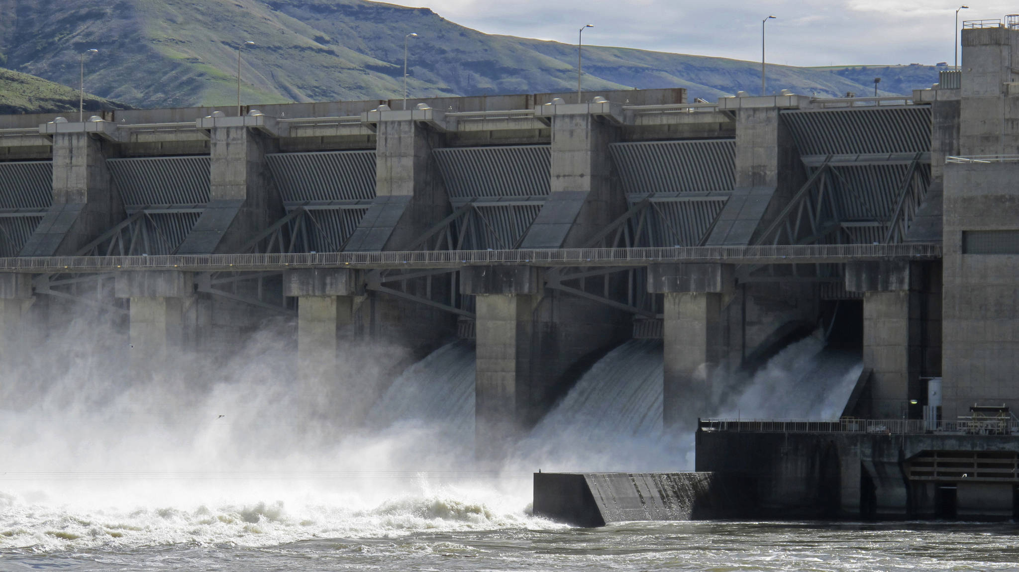 In this April 11, 2018, file photo, water moves through a spillway of the Lower Granite Dam on the Snake River near Almota, Wash. Some Republican members of Congress from the Northwest are accusing a GOP Idaho lawmaker of conducting secret negotiations with the Democratic governor of Oregon over a controversial proposal to breach four dams on the Snake River to save endangered salmon runs. (Nicholas K. Geranios/The Associated Press, file)