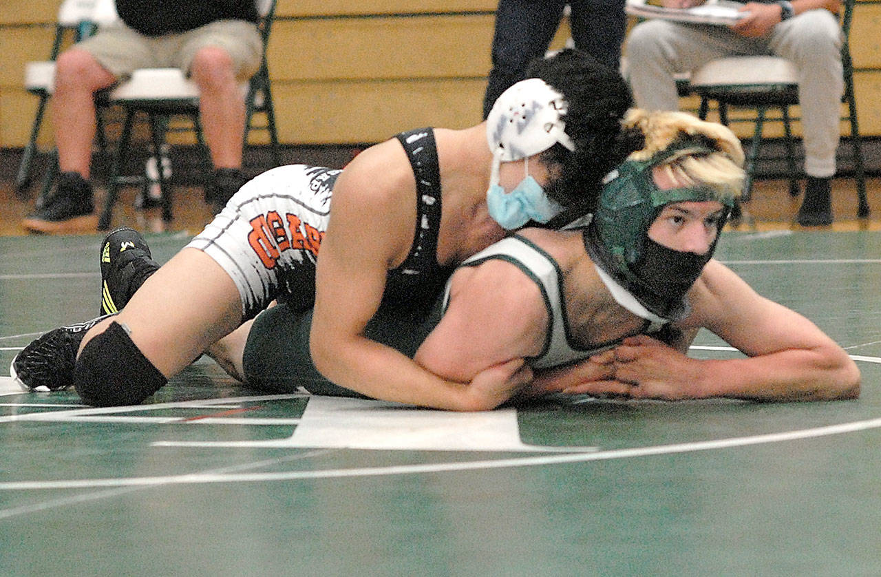 Keith Thorpe/Peninsula Daily News Port Angeles’ Jack Harrelson, front, takes on Central Kitsaps Shayne Hew-Len during Saturday’s four-wat meet at Port Angeles High School.