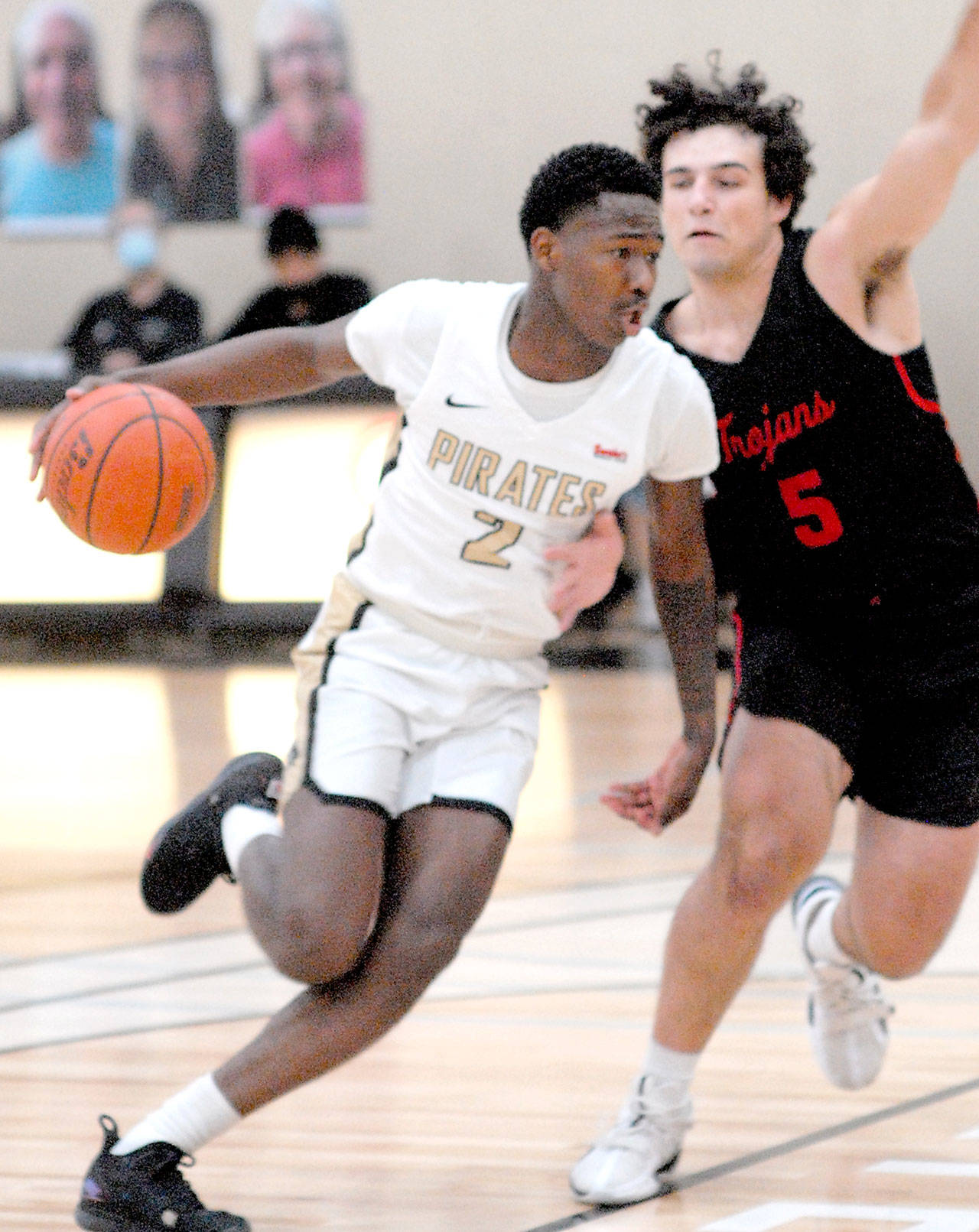 Keith Thorpe/Peninsula Daily News Peninsula’s Marcus Rodgers, left, drives past Everett’s Brayden Quantrille during Friday afternoon’s game at Peninsula College.