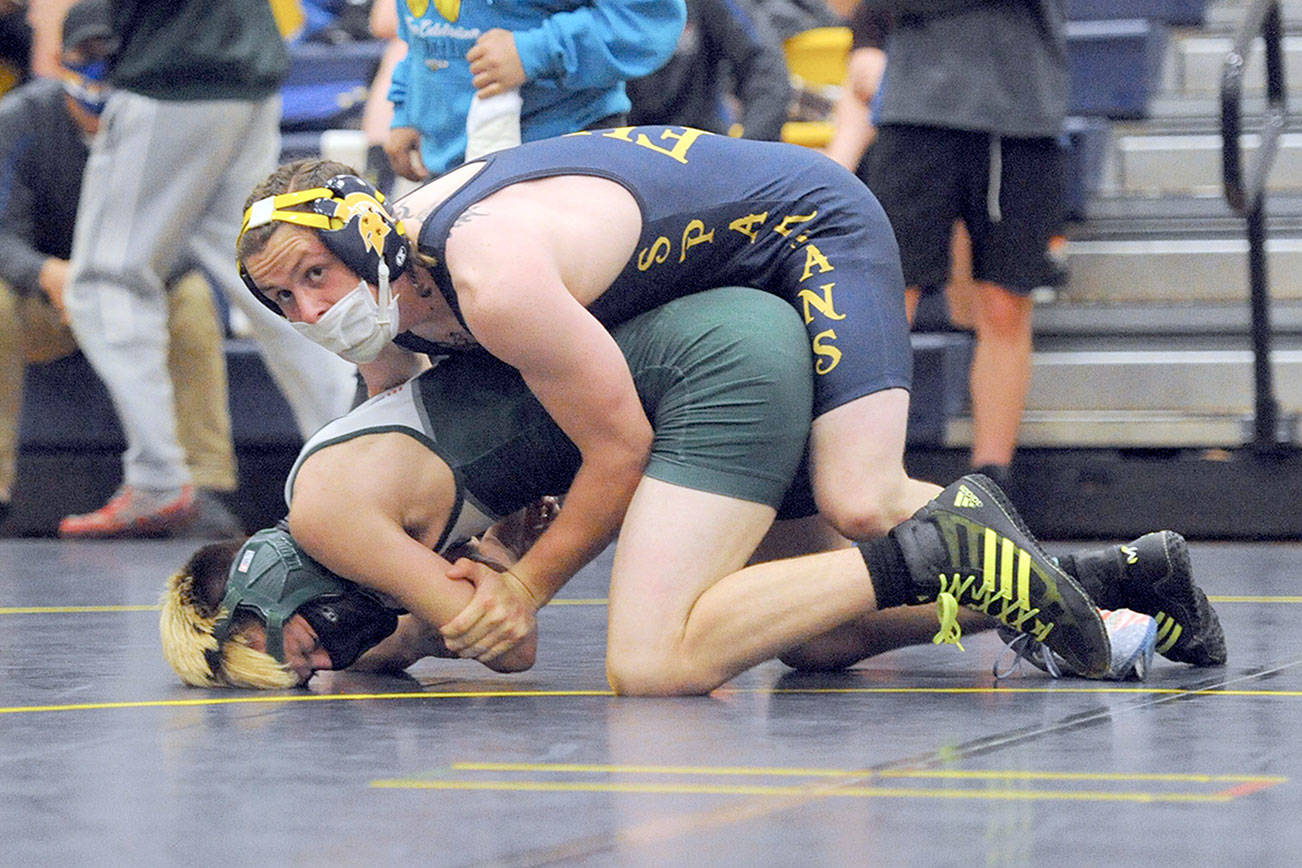 Spartan Colton Duncan pinned Roughrider Jack Harrelson in the 145 lb class..  Photo by Lonnie Achibald.