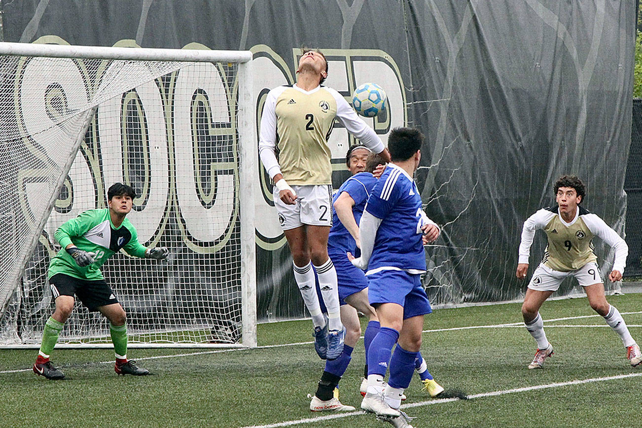 PC’s #2 Christopher Dominguez just misses a header into the goal of the Edmonds Tritons. #9 a teammate is Nicolas Hernandez. dlogan