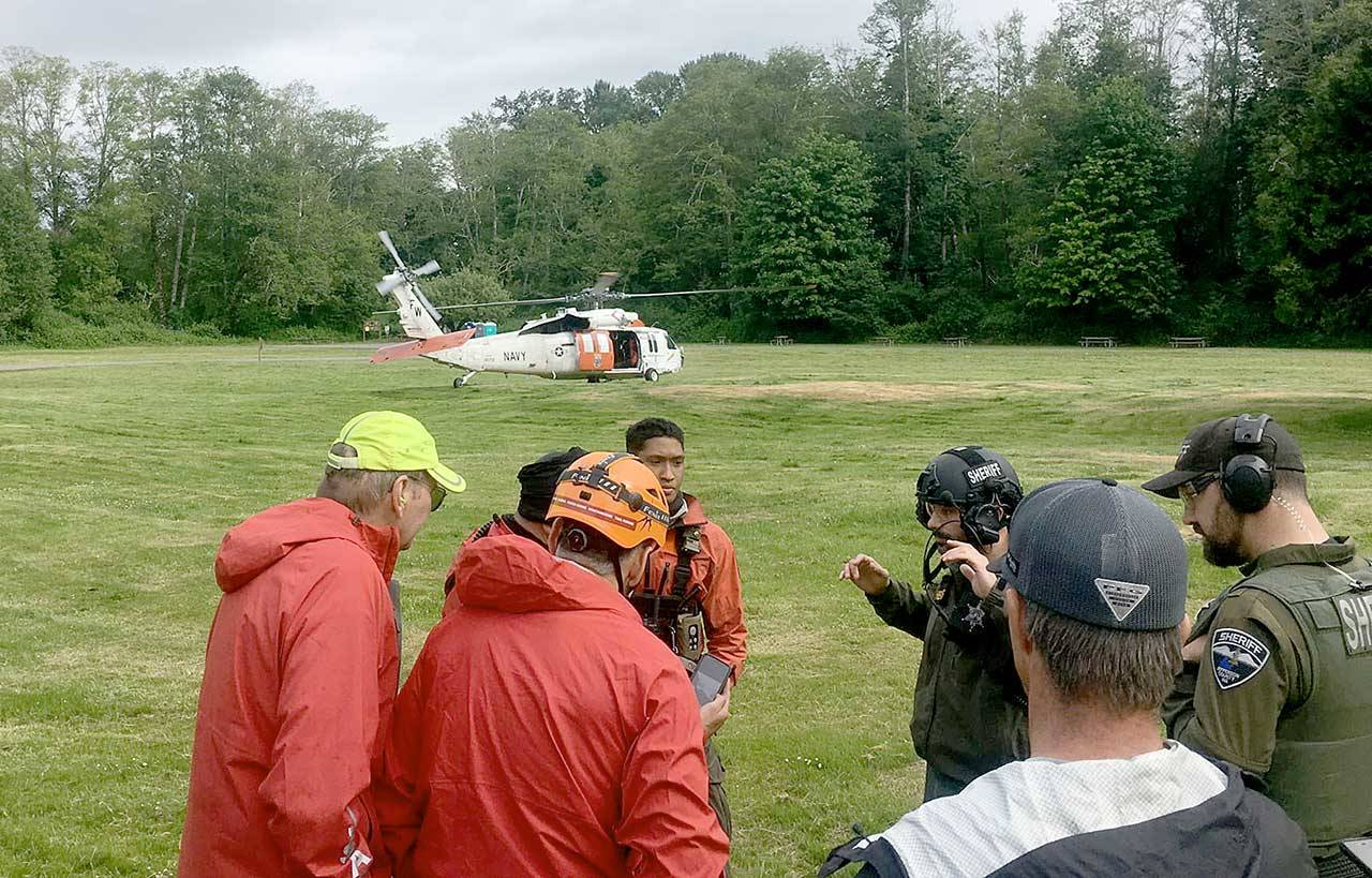 Search and Rescue team members used the Dosewallips State Parks field as their command post for the multi-agency rescue of two hikers who had fallen down the Brothers Mountain on Sunday afternoon. Teams from Jefferson Search and Rescue, Jefferson County Sheriffs Office, Naval Air Station Whidbey Island Search and Rescue and Olympic Mountain Rescue responded to the emergency. (Jefferson Search and Rescue)
