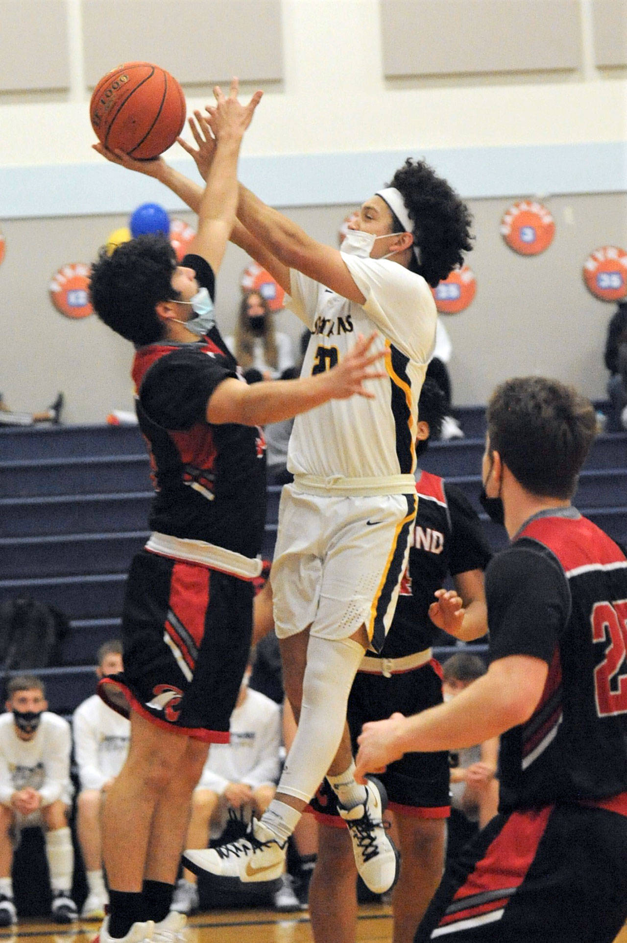 Forks senior Tony Hernandez-Flores drives the key against Raymond. Forks clinched a Pacific League 2B League championship by beating the Seagulls 79-34. (Photo by Lonnie Archibald.)